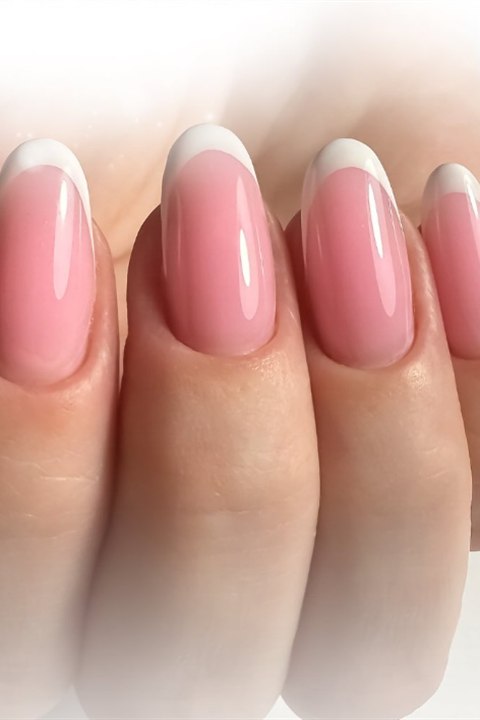 Classic pink and white French manicure on almond nails