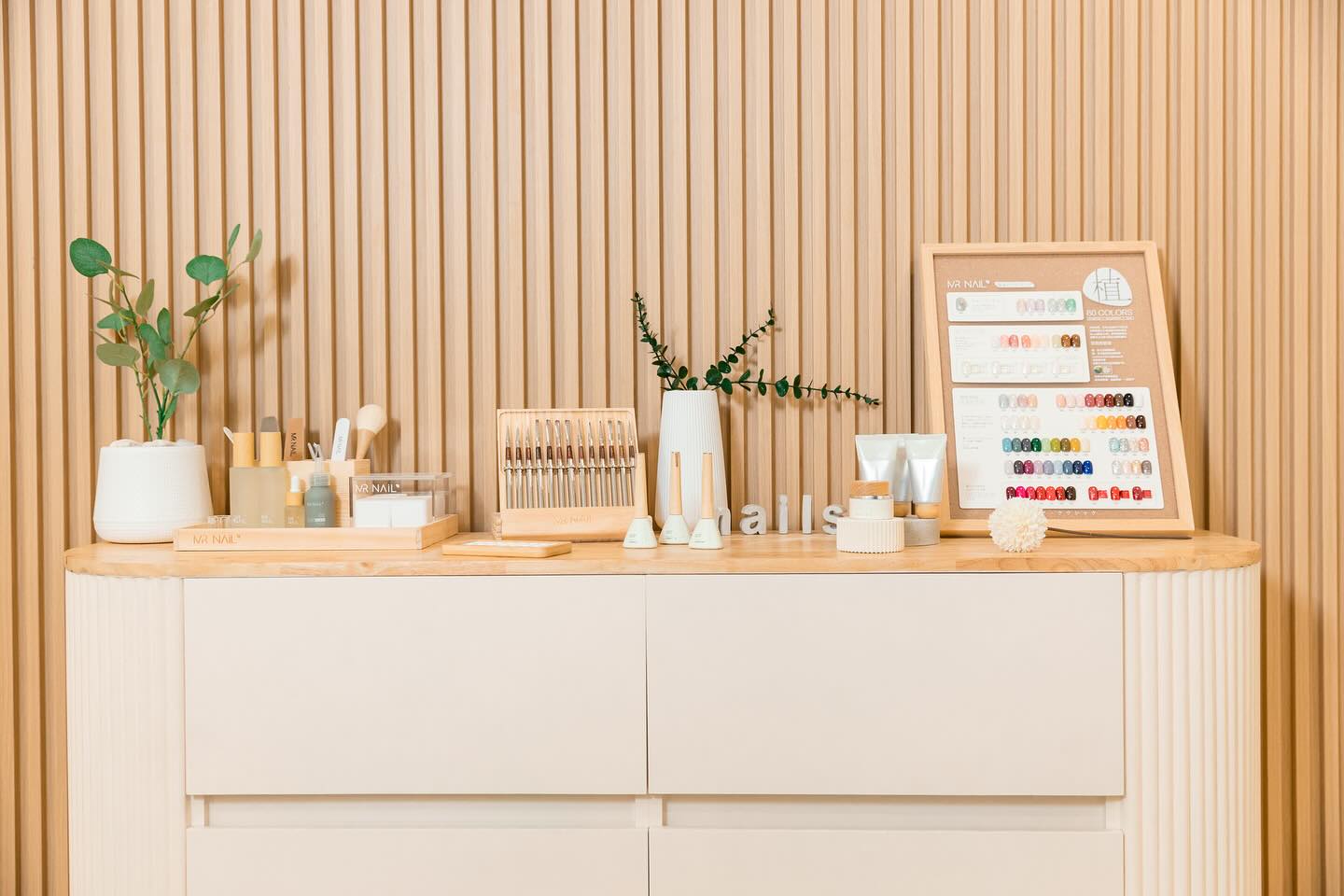 Inside the Nero Nails studio — brushes, tools and a wall of colour