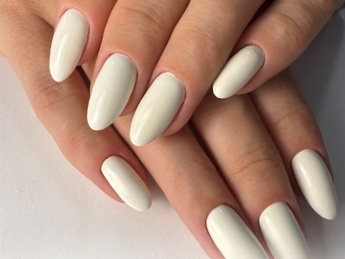 Ivory cream almond nails with a high-gloss finish