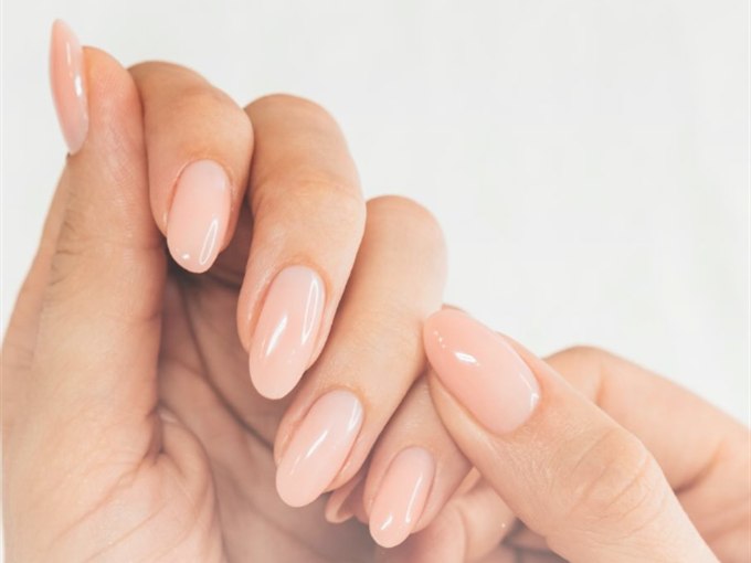 Peach nude oval manicure with a soft, glossy finish