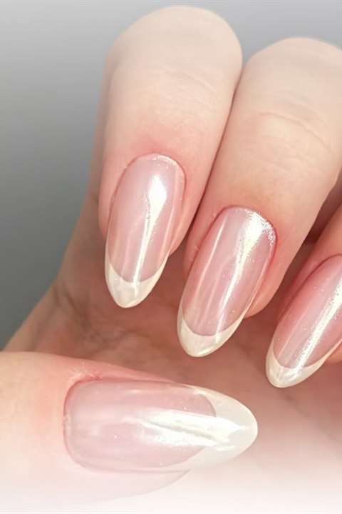 Pearl chrome French manicure on almond nails by Nero Nails